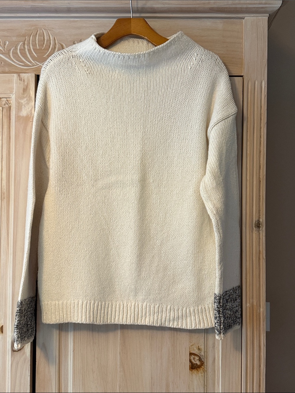 Ann Taylor cotton wool blend cream sweater with cream/black trim on sleeves.
